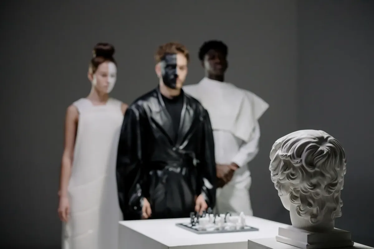 Stylized players in avant-garde fashion playing chess under dramatic lighting.